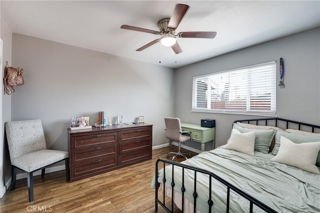 5734 Mountain View Avenue Riverside, CA 92504 - Photo 15 of 28 a bedroom that has a bed and a table in it