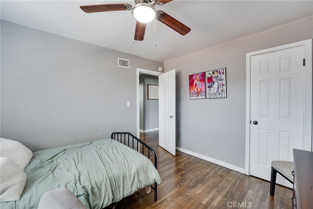 5734 Mountain View Avenue Riverside, CA 92504 - Photo 16 of 28 a bedroom with a bed and a chandelier