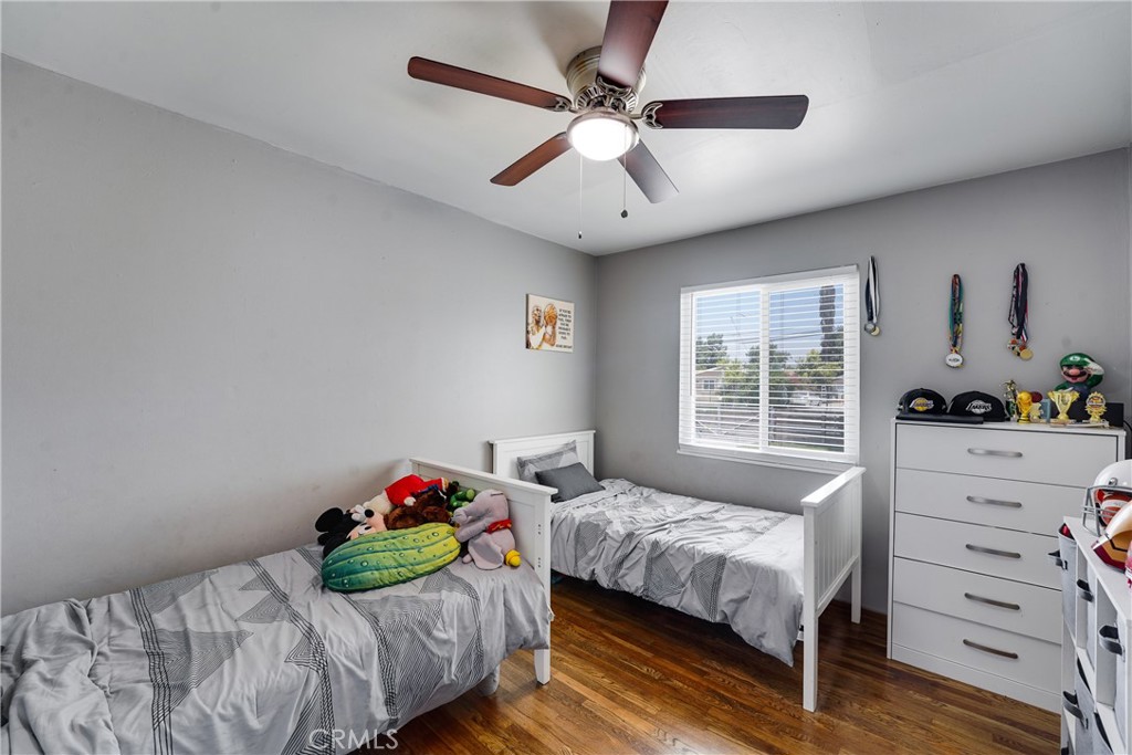 5734 Mountain View Avenue Riverside, CA 92504 - Photo 19 of 28 a bedroom with a bed and a window