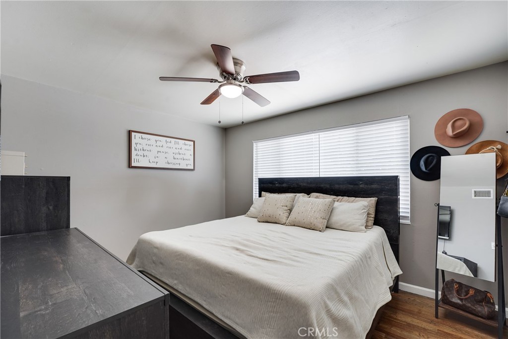 5734 Mountain View Avenue Riverside, CA 92504 - Photo 20 of 28 a bedroom with a bed and a chandelier