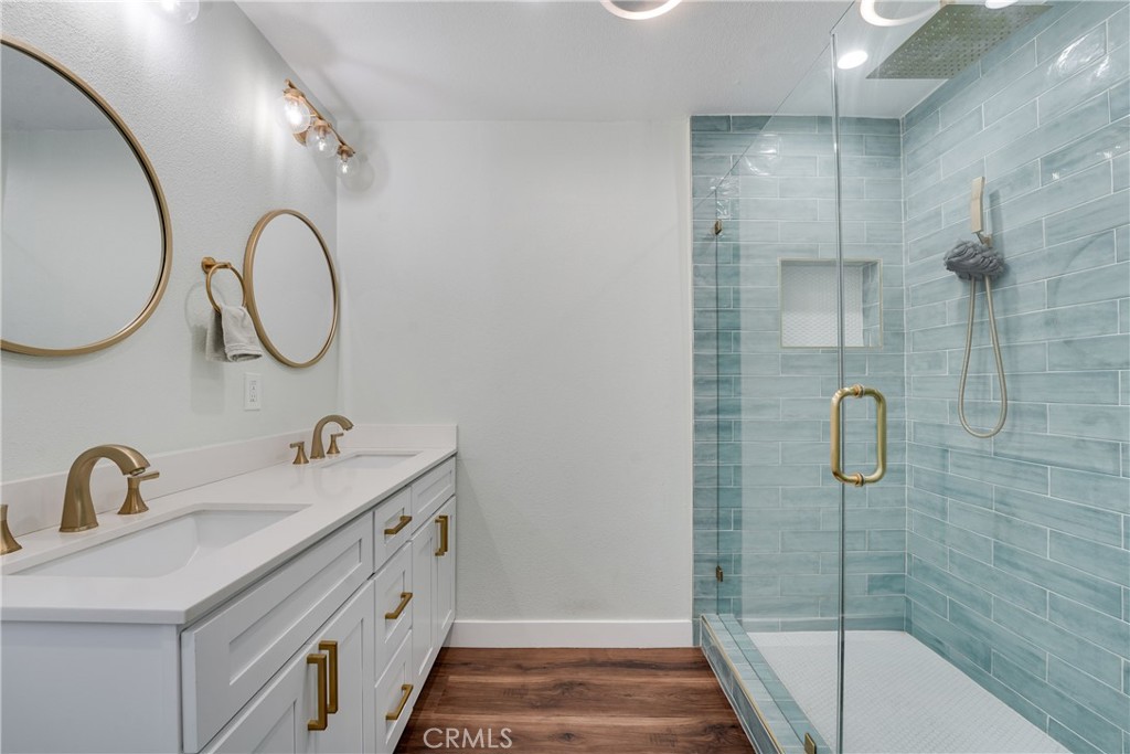 5734 Mountain View Avenue Riverside, CA 92504 - Photo 22 of 28 a bathroom with a sink and a mirror