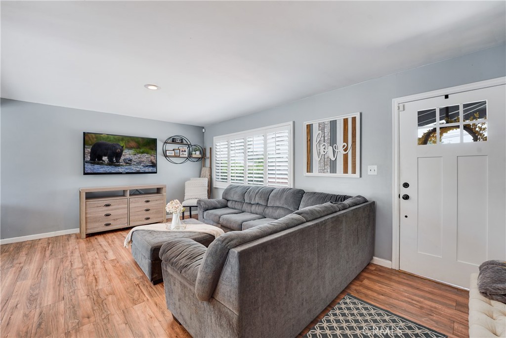 5734 Mountain View Avenue Riverside, CA 92504 - Photo 6 of 28 a living room with furniture and a flat screen tv
