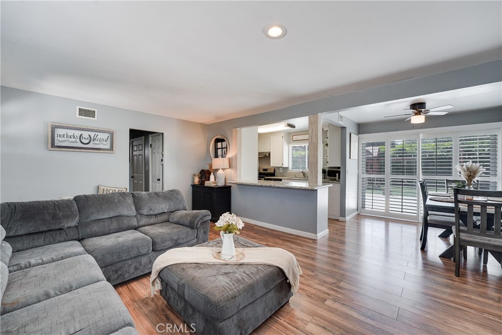 5734 Mountain View Avenue Riverside, CA 92504 - Photo 7 of 28 a living room with furniture and wooden floor