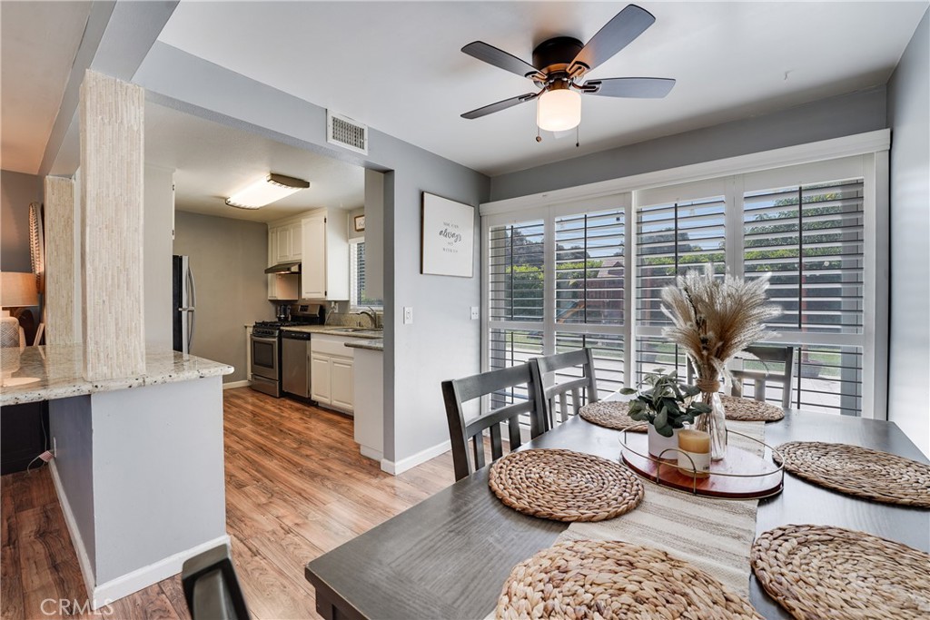5734 Mountain View Avenue Riverside, CA 92504 - Photo 8 of 28 a living room with furniture and a large window
