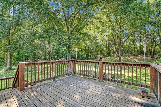 a view of deck with wooden floor and fence