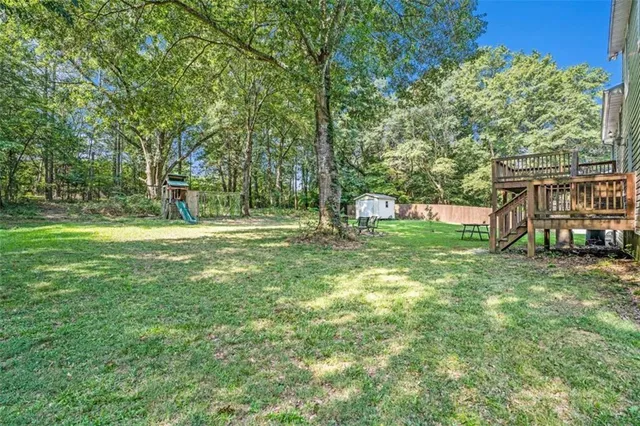 a view of a park with large trees