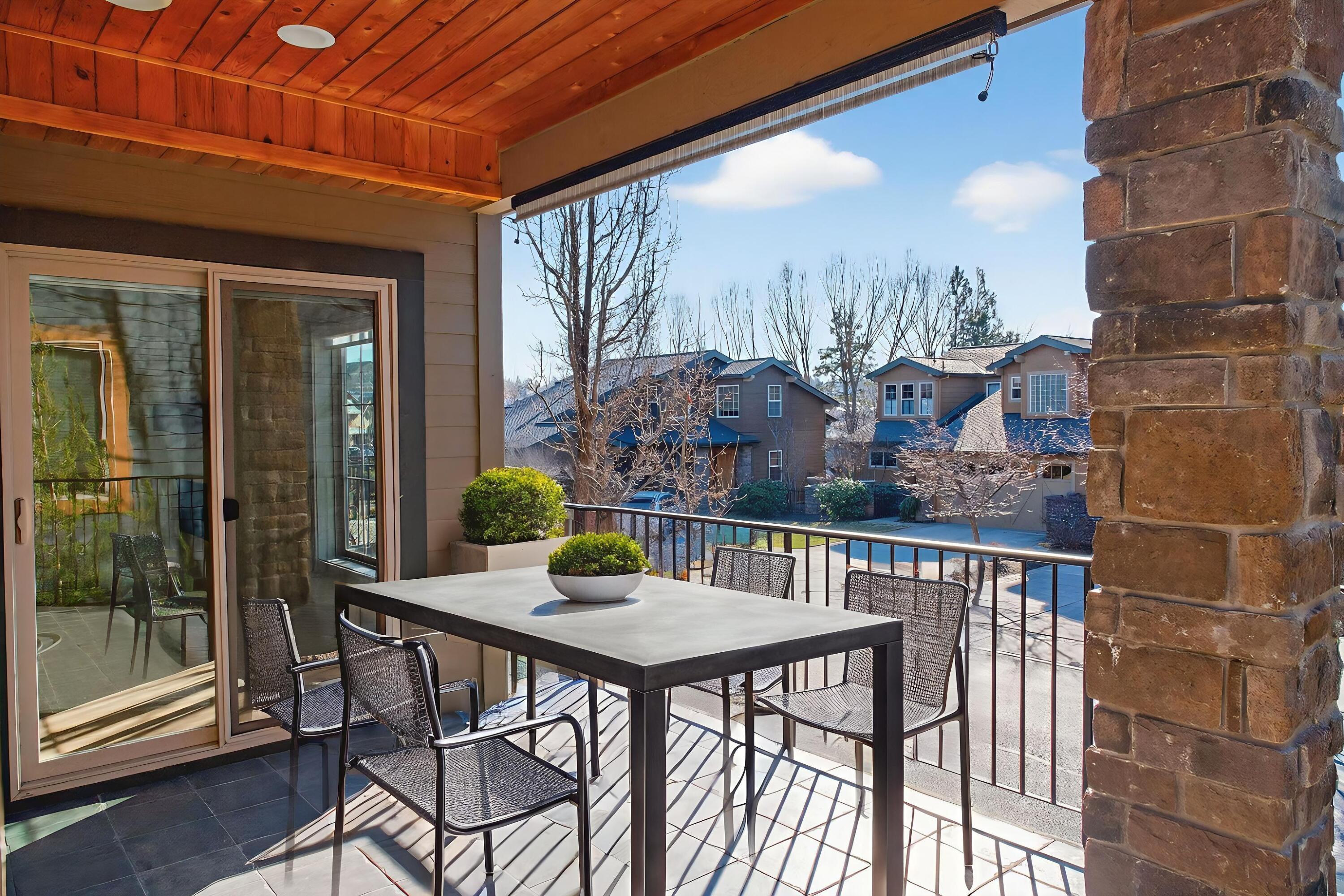 680 Southwest Otter Way Bend, OR 97702 - Photo 15 of 48 a view of balcony with a table and chairs