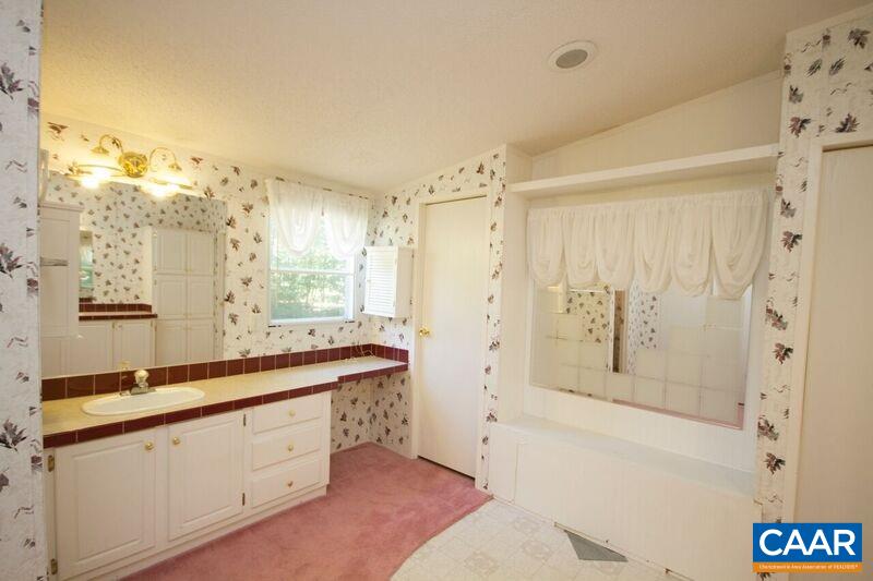 18 Tabscott Road Kents Store, VA 23084 - Photo 19 of 46 a spacious bathroom with double vanity and a bathtub