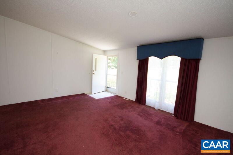 18 Tabscott Road Kents Store, VA 23084 - Photo 3 of 46 a view of empty room with front door
