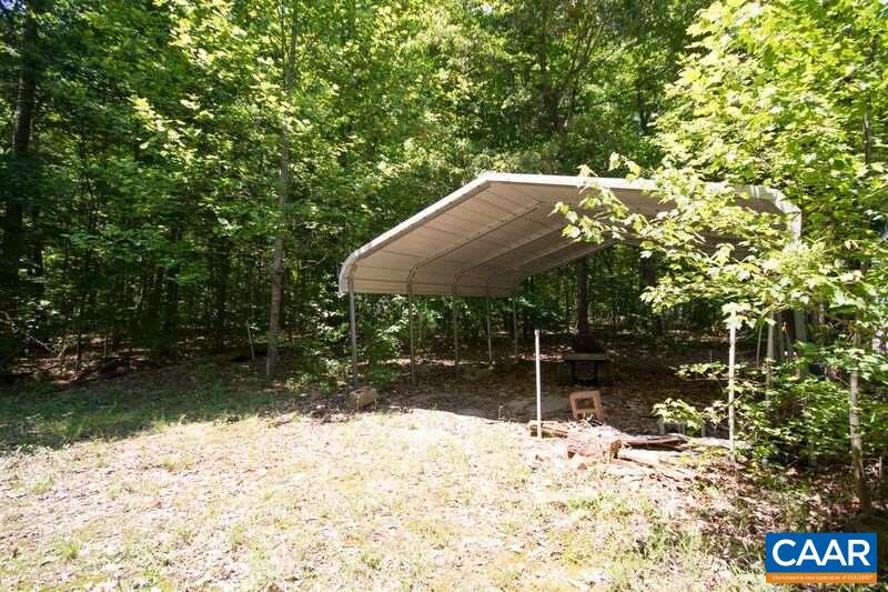 18 Tabscott Road Kents Store, VA 23084 - Photo 40 of 46 a backyard of a house with yard and outdoor seating