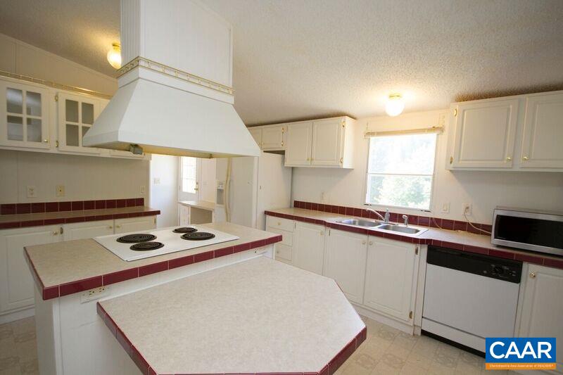 18 Tabscott Road Kents Store, VA 23084 - Photo 7 of 46 a kitchen with stainless steel appliances a sink a stove cabinets counter space and a window