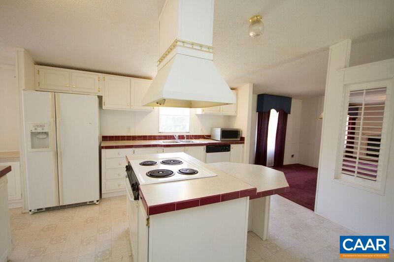 18 Tabscott Road Kents Store, VA 23084 - Photo 8 of 46 a kitchen with a refrigerator a stove a sink dishwasher and a refrigerator with wooden floor