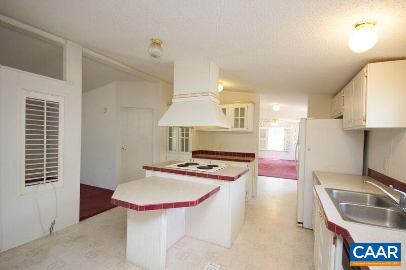 18 Tabscott Road Kents Store, VA 23084 - Photo 9 of 46 a kitchen with stainless steel appliances a stove a sink and a refrigerator