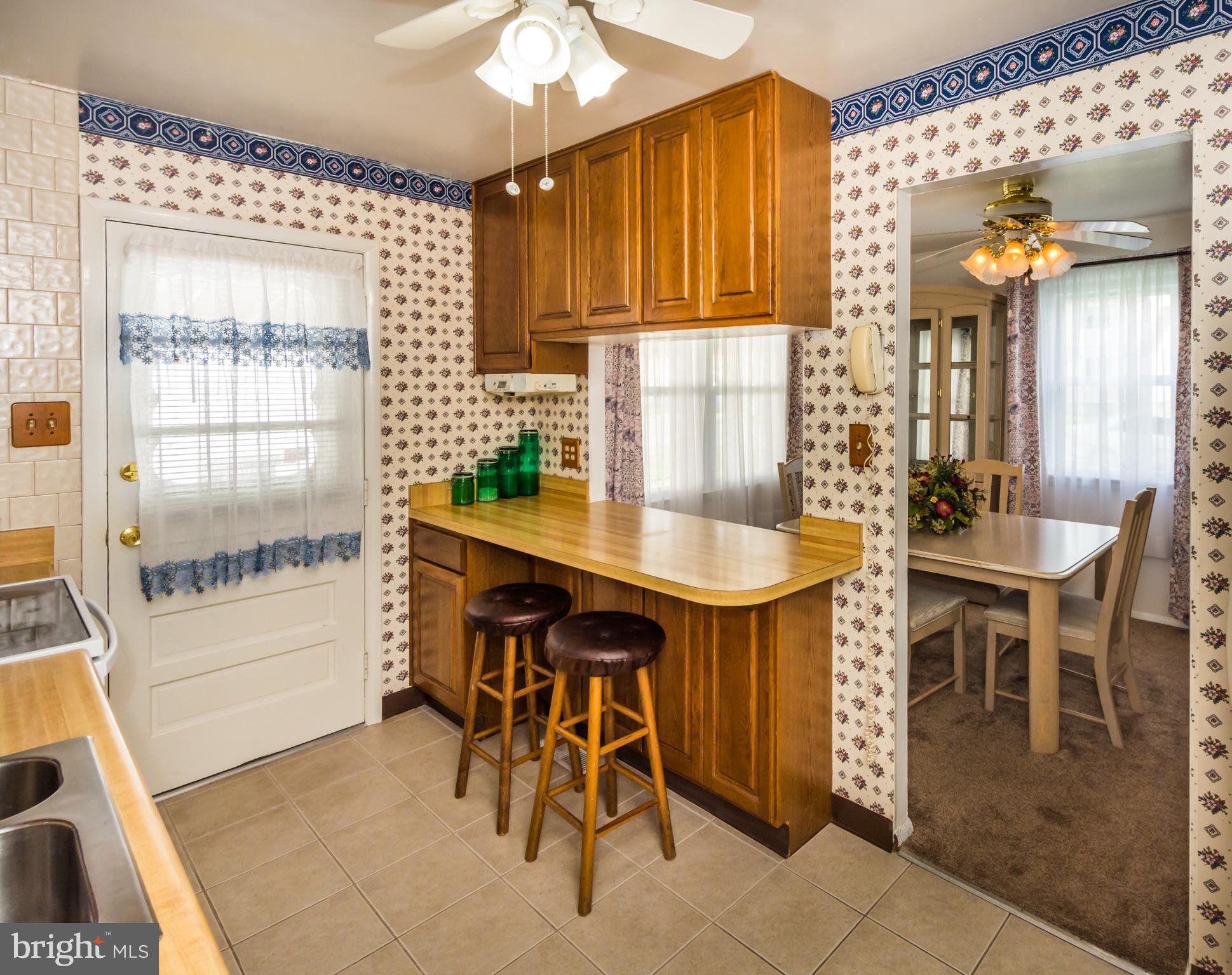 2137 Sunnythorn Road Baltimore, MD 21220 - Photo 15 of 34 a kitchen with a table and chairs