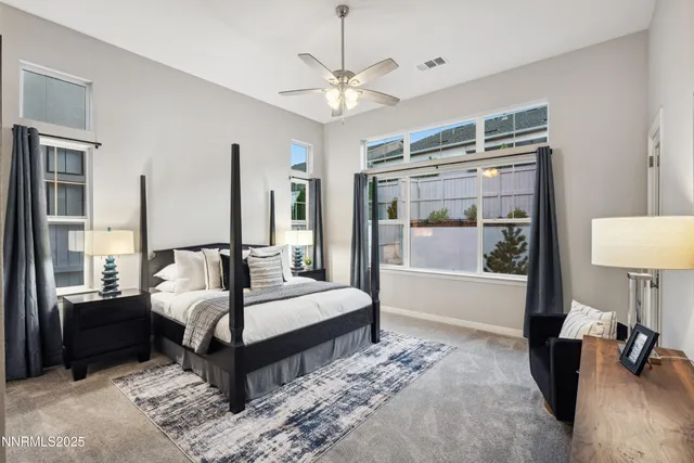 a view of a dining area with furniture and a large window