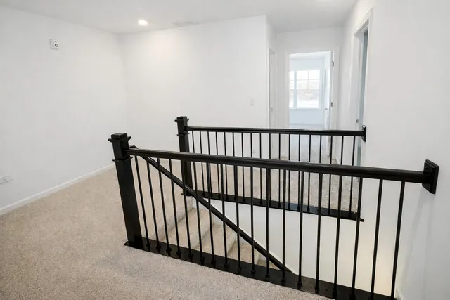 a view of a hallway with a window