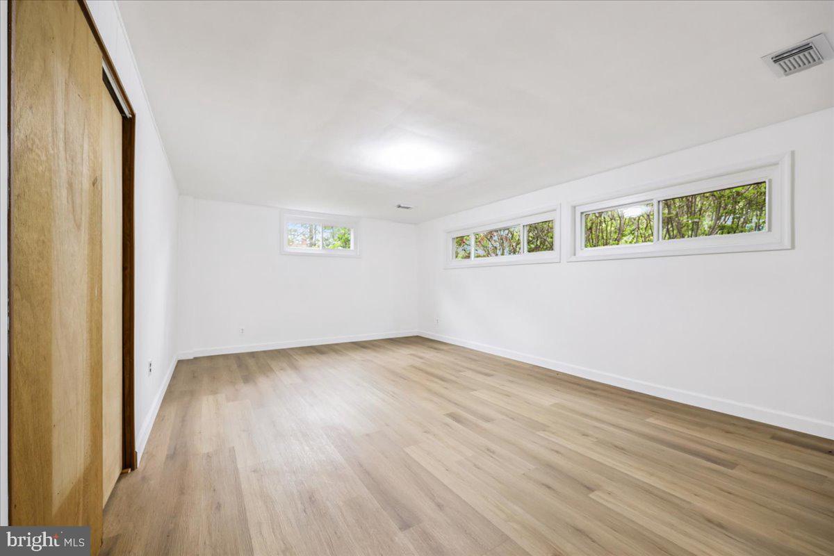 1901 Ladd Street Silver Spring, MD 20902 - Photo 16 of 101 an empty room with wooden floor and windows