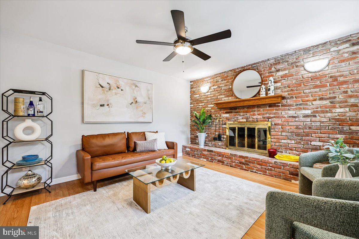 1901 Ladd Street Silver Spring, MD 20902 - Photo 34 of 101 a living room with furniture and a fireplace