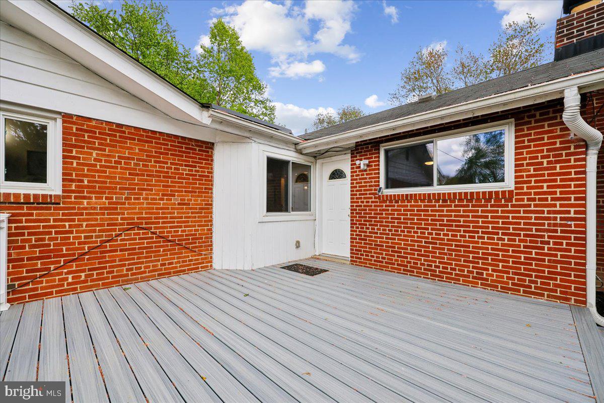1901 Ladd Street Silver Spring, MD 20902 - Photo 39 of 101 a backyard of a house with wooden floor and brick walls