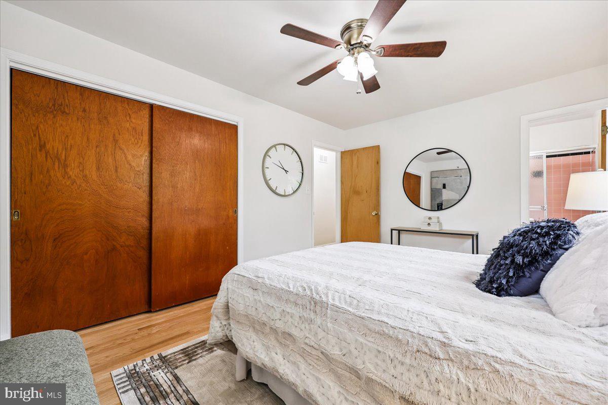 1901 Ladd Street Silver Spring, MD 20902 - Photo 43 of 101 a bedroom with a bed and a chandelier
