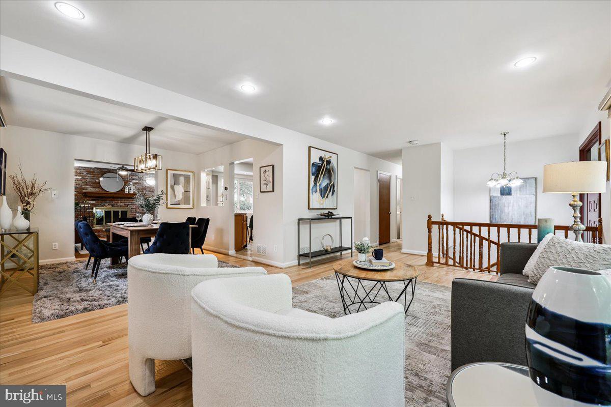 1901 Ladd Street Silver Spring, MD 20902 - Photo 5 of 101 a living room with furniture a rug and a dining table