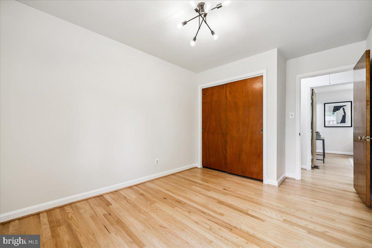 1901 Ladd Street Silver Spring, MD 20902 - Photo 53 of 101 a view of empty room with wooden floor and fan