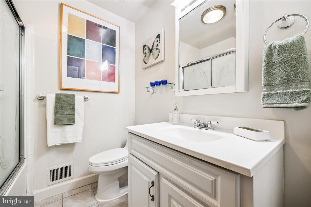 1901 Ladd Street Silver Spring, MD 20902 - Photo 54 of 101 a bathroom with a sink a toilet and a mirror