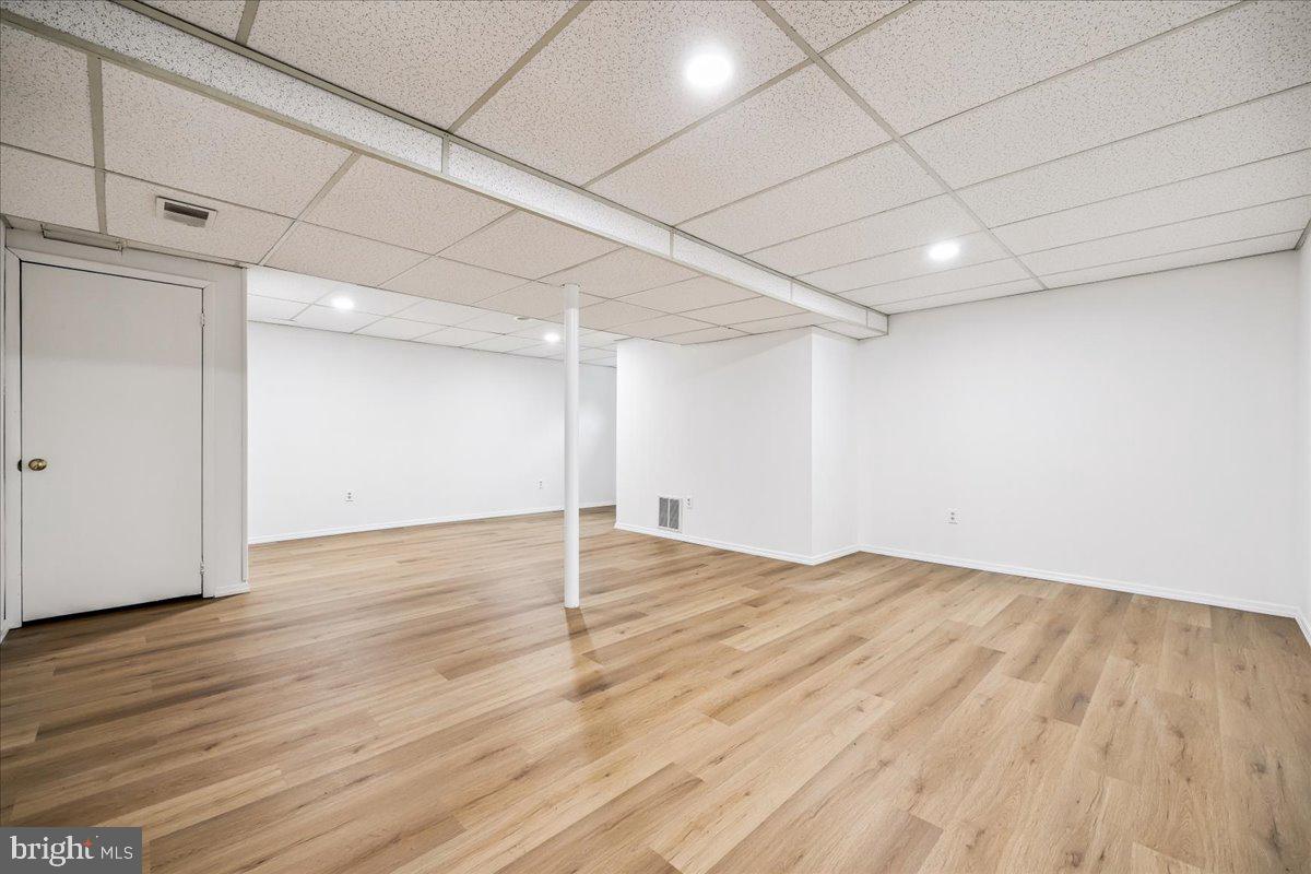 1901 Ladd Street Silver Spring, MD 20902 - Photo 59 of 101 a view of an empty room with wooden floor