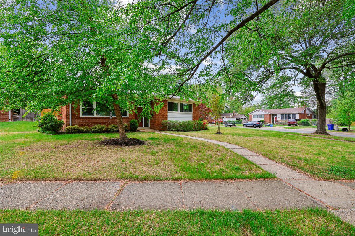 1901 Ladd Street Silver Spring, MD 20902 - Photo 80 of 101 a front view of a house with a yard