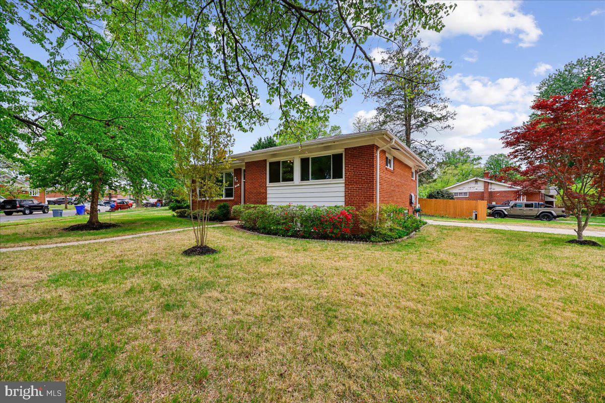 1901 Ladd Street Silver Spring, MD 20902 - Photo 83 of 101 a front view of a house with a yard garage and trees