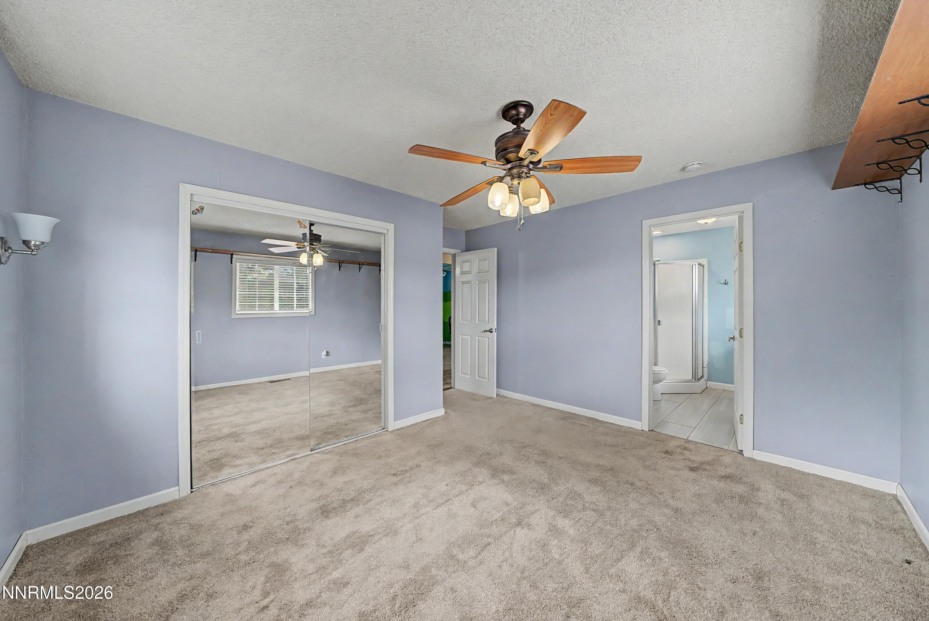 11577 Deodar Way Reno, NV 89506 - Photo 3 of 58 an empty room with a view of a hallway