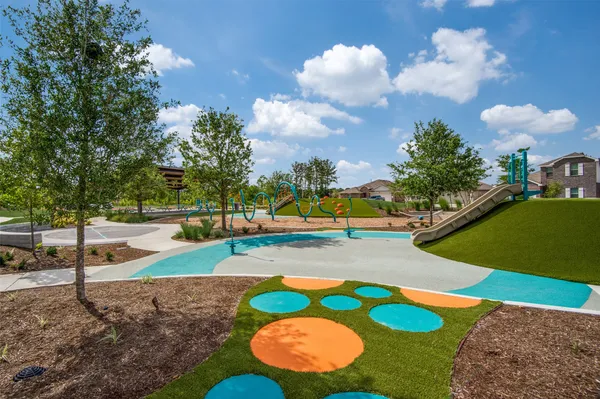 a view of a playground with basketball court