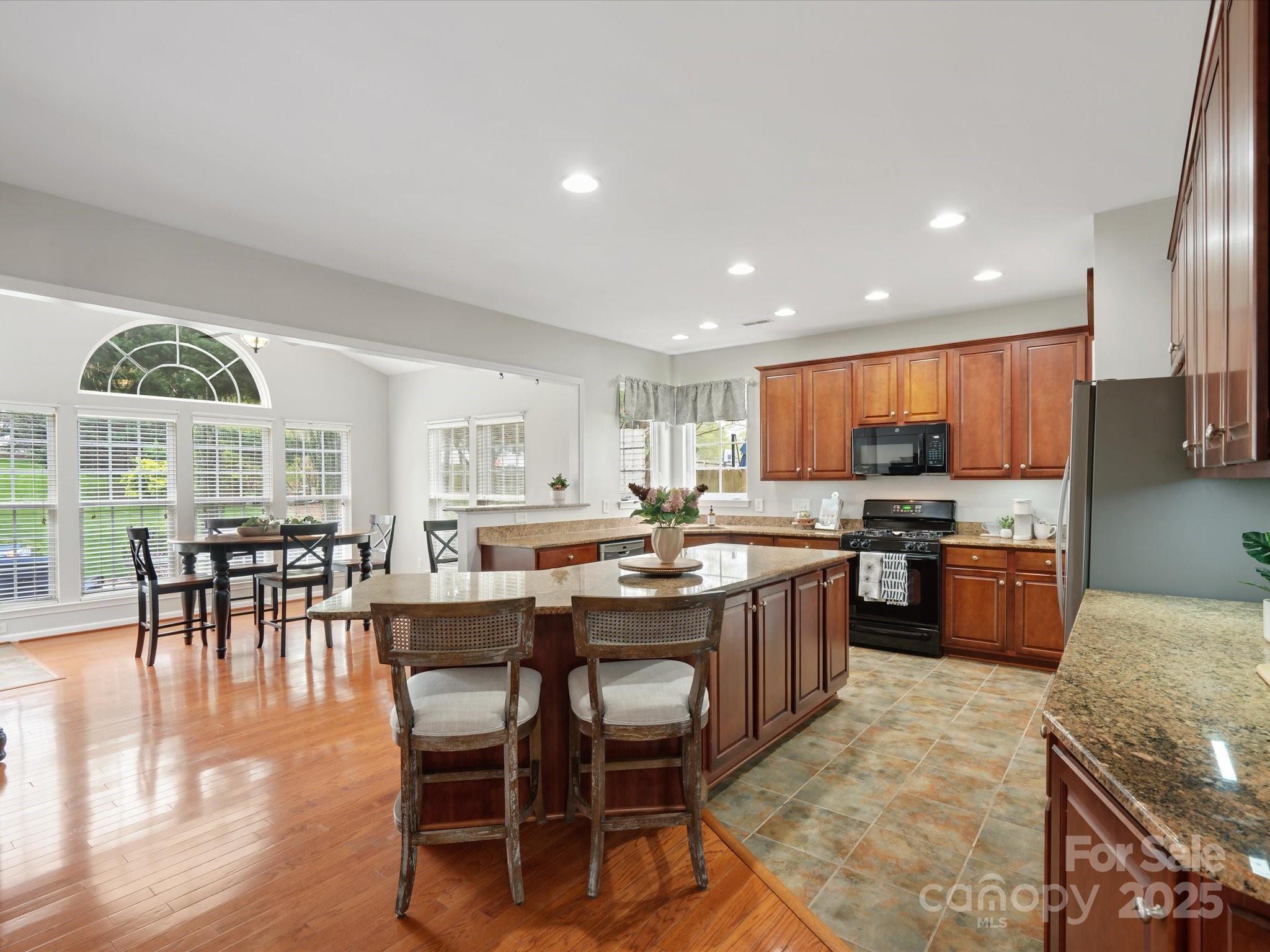 809 Circle Trace Road Monroe, NC 28110 - Photo 20 of 47 a large kitchen with a table and chairs