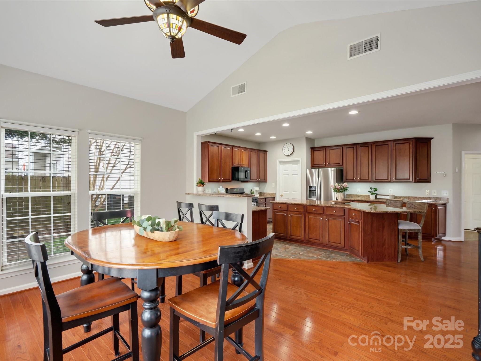 809 Circle Trace Road Monroe, NC 28110 - Photo 21 of 47 a view of a dining room with furniture window and wooden floor