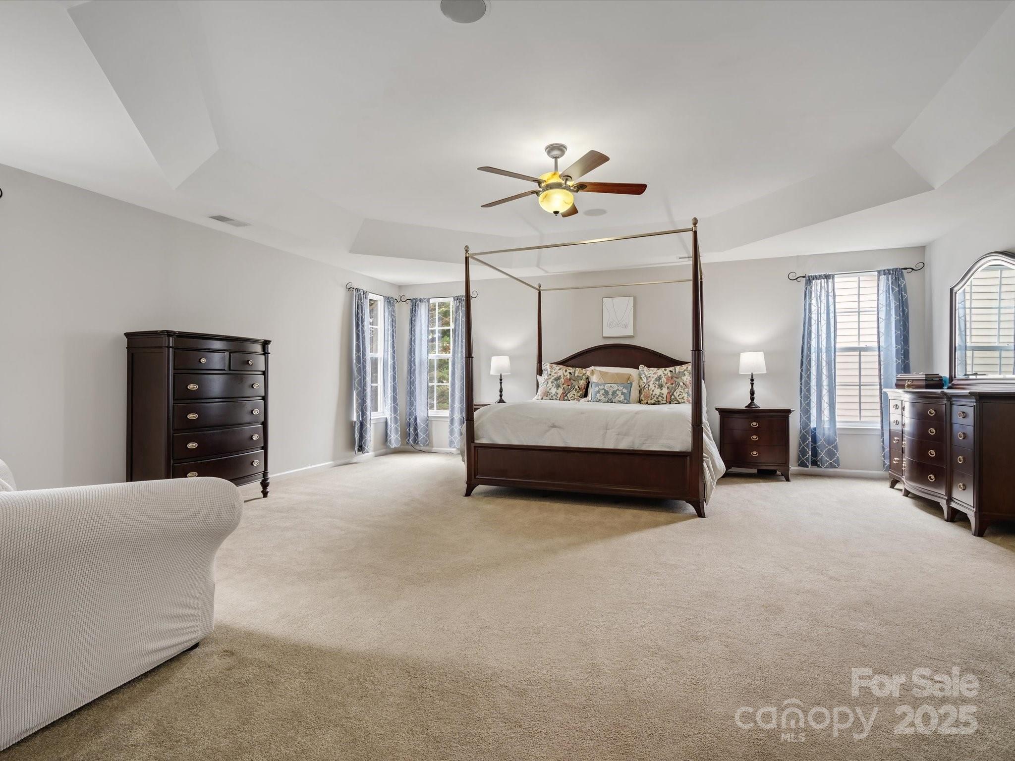 809 Circle Trace Road Monroe, NC 28110 - Photo 28 of 47 a spacious bedroom with a bed and a couch
