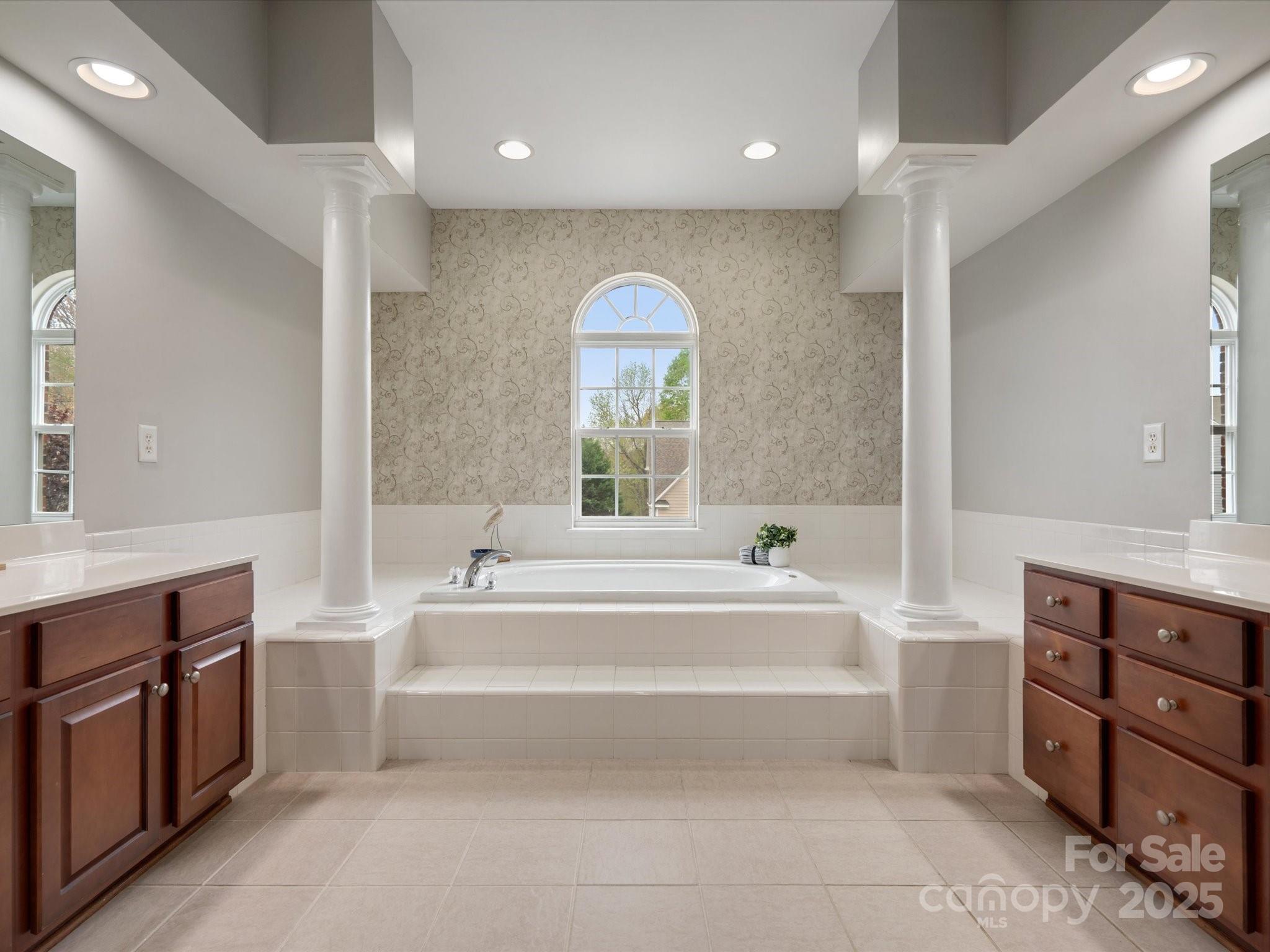 809 Circle Trace Road Monroe, NC 28110 - Photo 30 of 47 a spacious bathroom with a tub double sink and a mirror