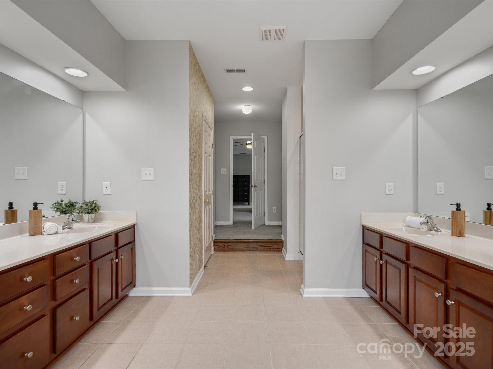 809 Circle Trace Road Monroe, NC 28110 - Photo 32 of 47 a spacious bathroom with a double vanity sink and a mirror