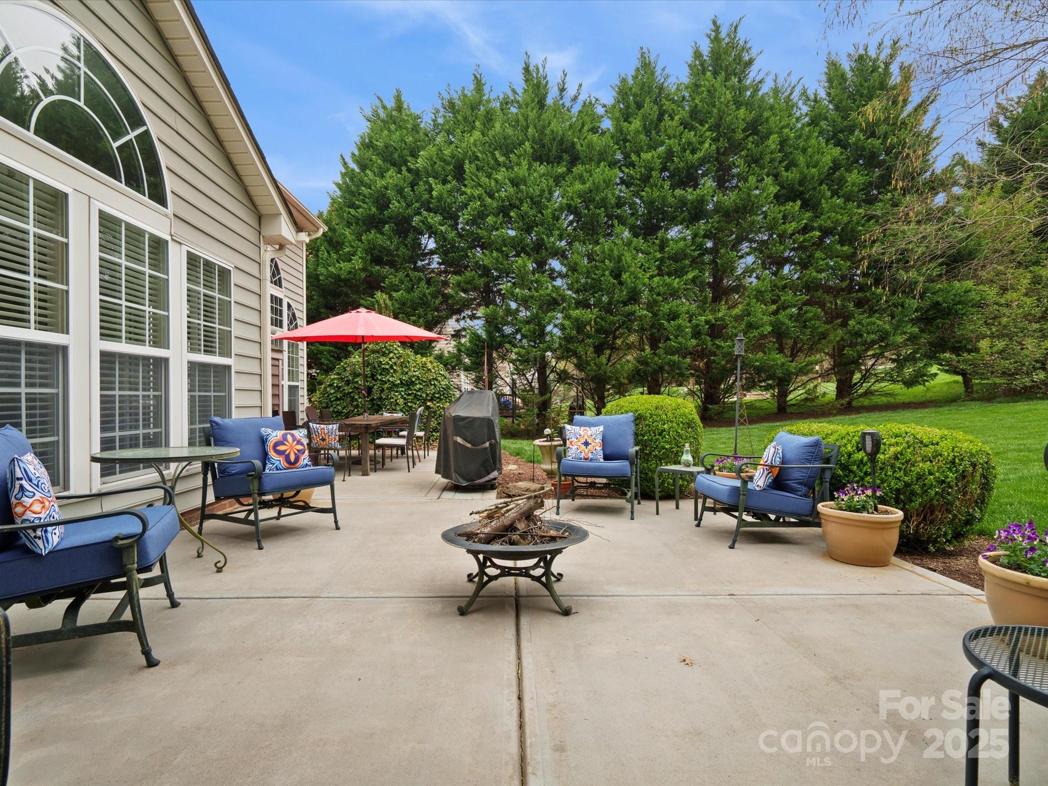 809 Circle Trace Road Monroe, NC 28110 - Photo 42 of 47 a group of chairs sitting in patio with a fire pit and a table