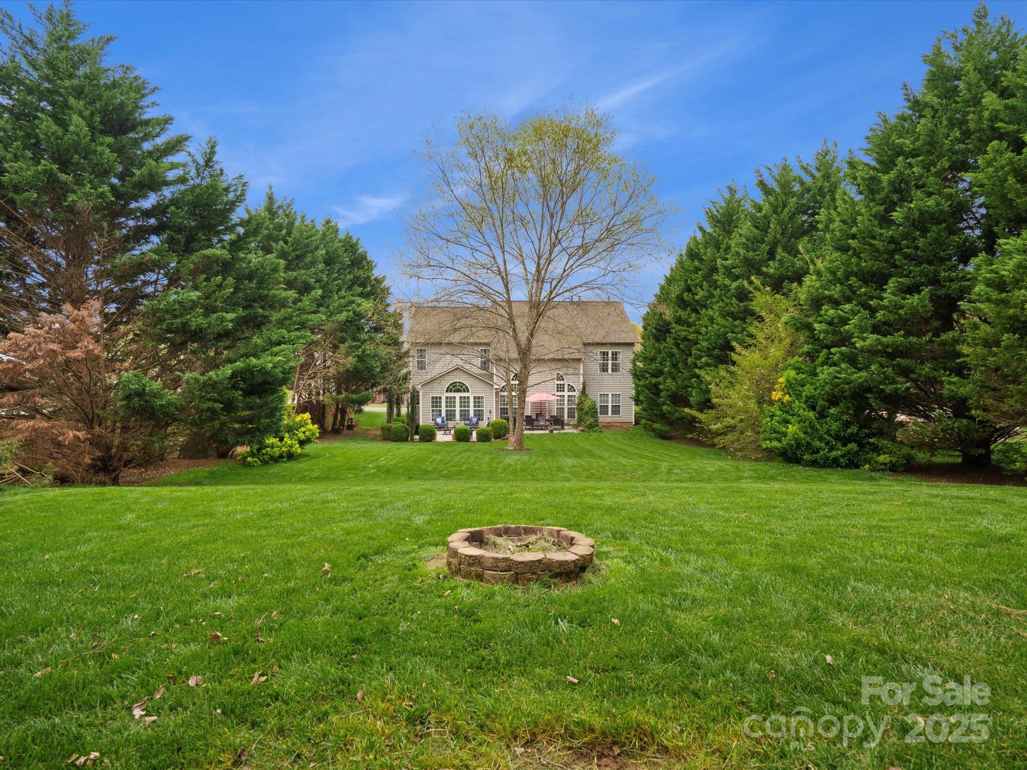809 Circle Trace Road Monroe, NC 28110 - Photo 45 of 47 a view of a garden with a tree