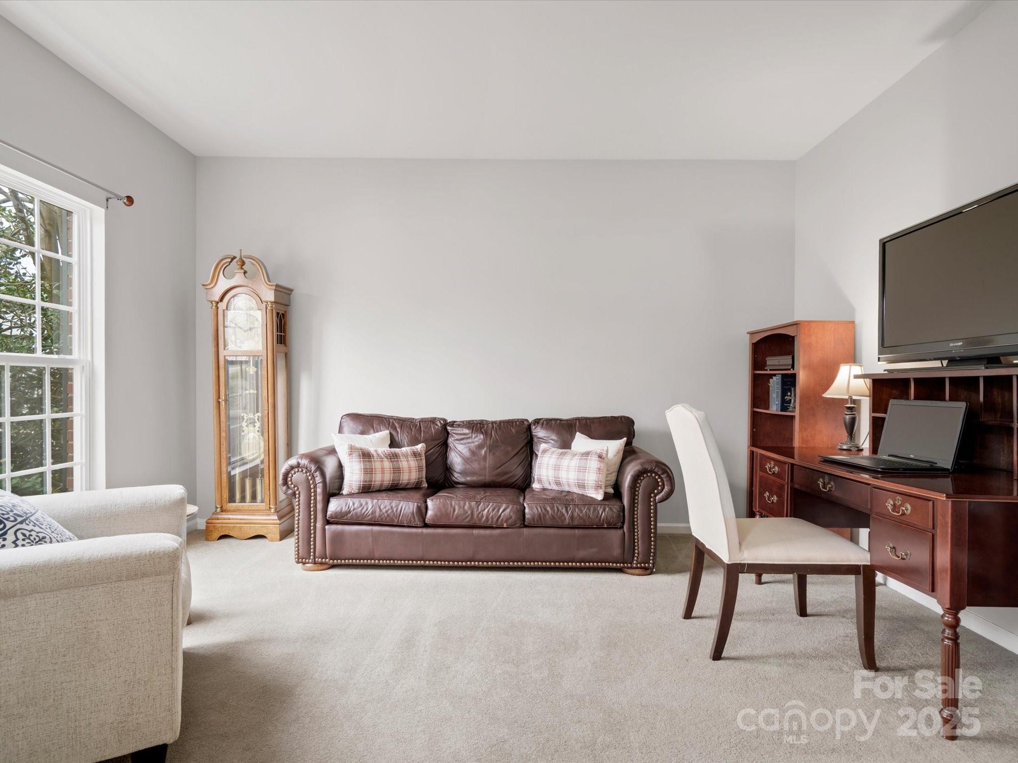 809 Circle Trace Road Monroe, NC 28110 - Photo 9 of 47 a living room with furniture and a flat screen tv