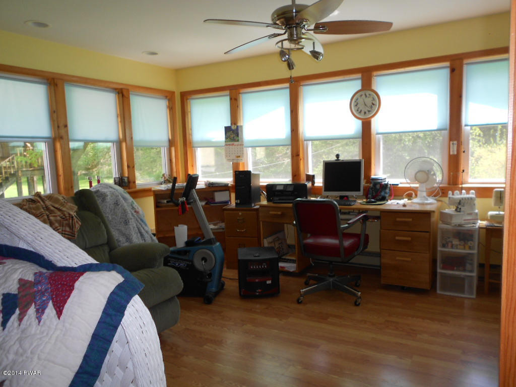 85 Elk Brook Road Road Delhi, NY 13753 - Photo 6 of 11 a living room with furniture city view and large windows