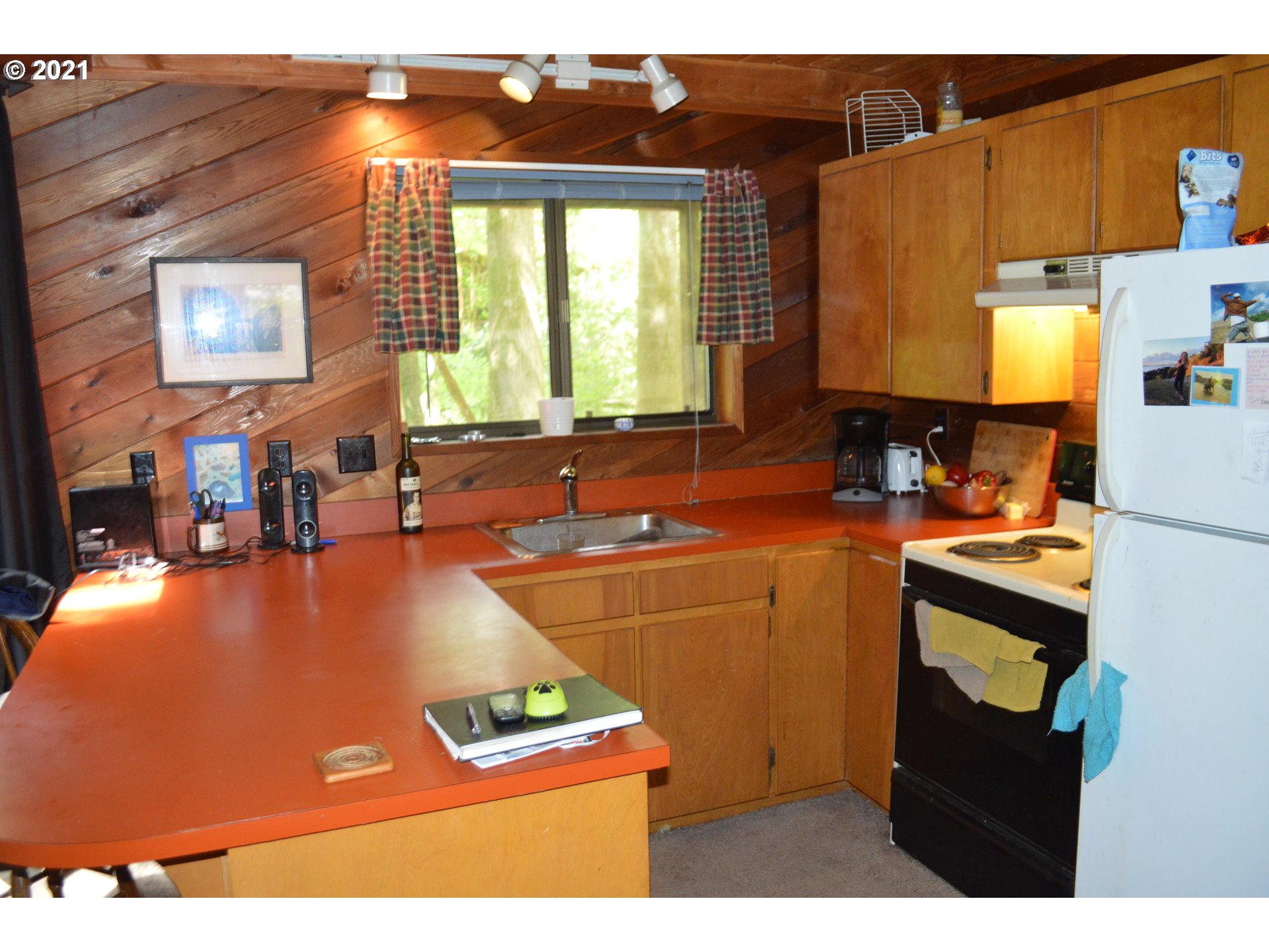 72901 East Village Loop Road Rhododendron, OR 97049 - Photo 8 of 28 a room with furniture a window and a flat screen tv