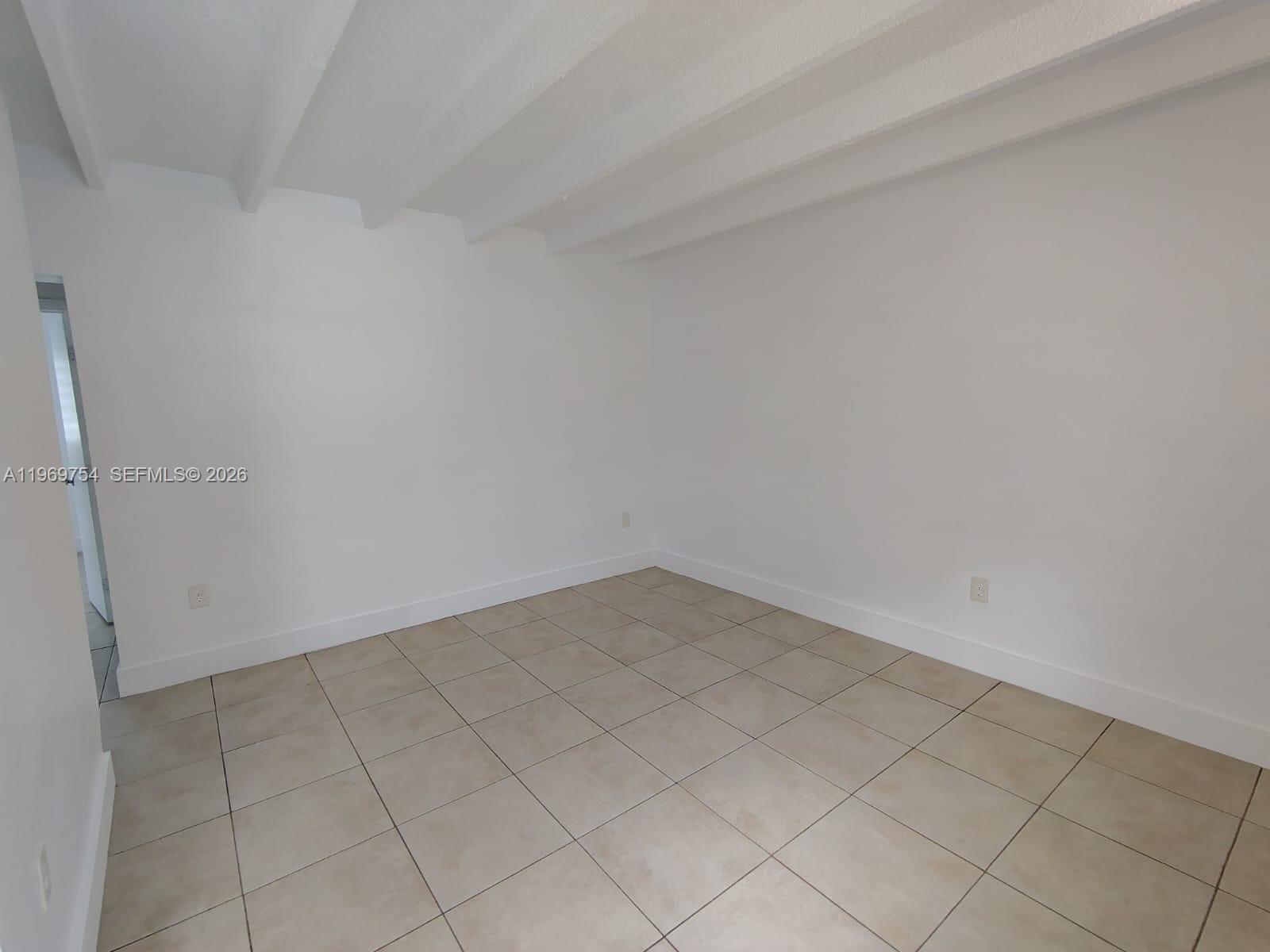741 Northwest 60th Street, Unit 3 Miami, FL 33127 - Photo 7 of 15 a view of an empty room