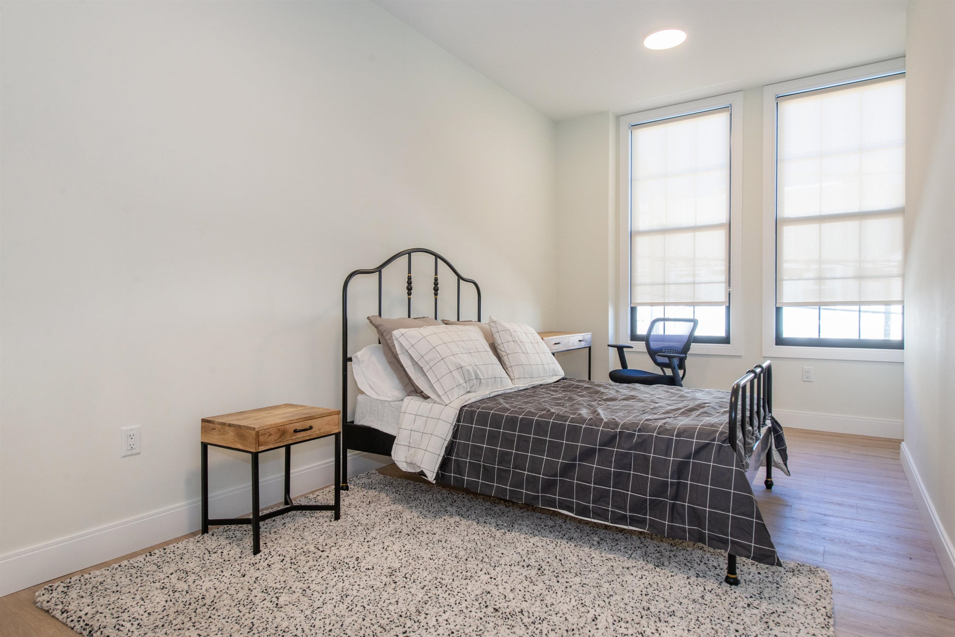 3510 Bergenline Avenue, Unit 205 Union City, NJ 07087 - Photo 19 of 21 a bedroom with bed and a window