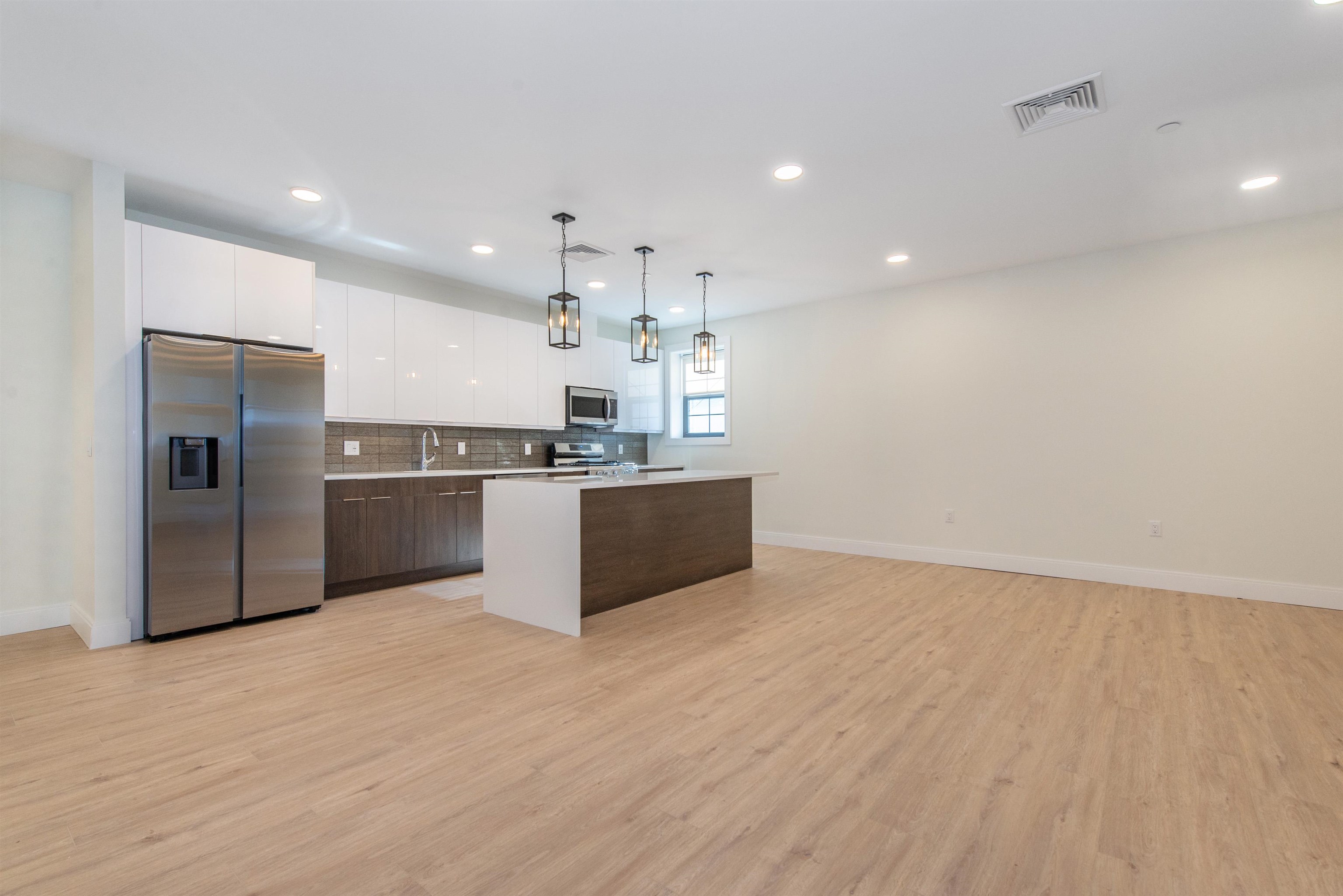 3510 Bergenline Avenue, Unit 205 Union City, NJ 07087 - Photo 3 of 21 a kitchen with stainless steel appliances a refrigerator and a sink