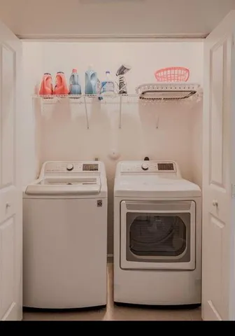 a utility room with dryer and washer