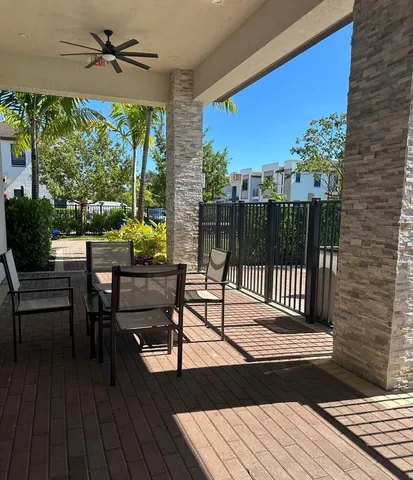 a view of a chairs and tables in the balcony