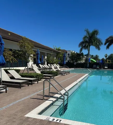 a view of a swimming pool with chairs