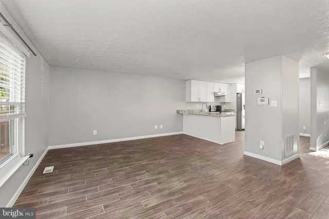a view of a kitchen with wooden floor