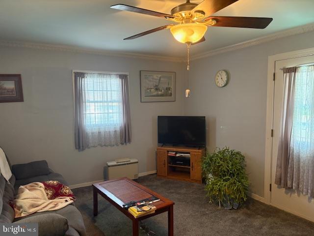 4928 Bethlehem Road Preston, MD 21655 - Photo 4 of 19 a living room with furniture and a flat screen tv